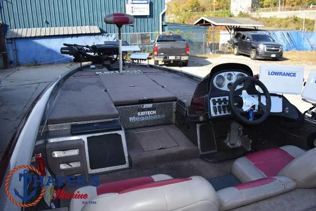 Slide: The Image of 2010 Skeeter ZX225 bass boat interior with steering wheel and electronics. - 38