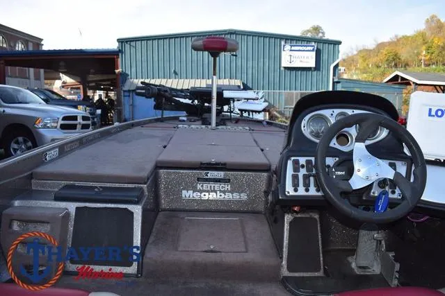 Slide: The Image of 2010 Skeeter ZX225 boat interior with steering wheel and control panel. - 39
