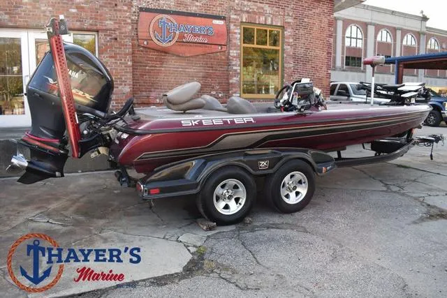 Slide: The Image of 2010 Skeeter ZX225 bass boat at Thayer's Marine dealership. - 47