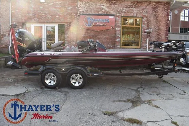 Slide: The Image of 2010 Skeeter ZX225 boat at Thayer's Marine, parked on a trailer. - 48