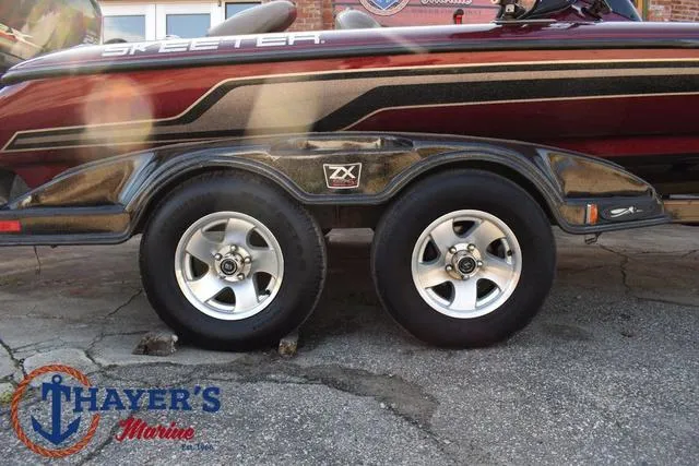 Slide: The Image of 2010 Skeeter ZX225 boat trailer with dual wheels at Thayer's Marine. - 5