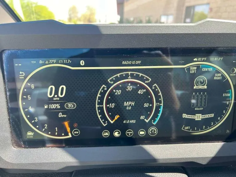 Slide: The Image of Dashboard of 2021 Malibu 22 LSV boat showing speedometer and controls. - 16