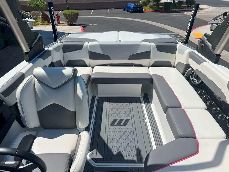 Slide: The Image of 2021 Malibu 22 LSV boat interior with luxurious seating and modern design. - 17