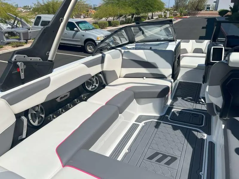 Slide: The Image of 2021 Malibu 22 LSV boat interior with sleek seating and modern design. - 18