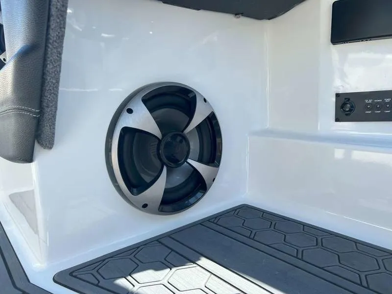 Slide: The Image of 2021 Malibu 22 LSV boat interior with speaker and control panel. - 19