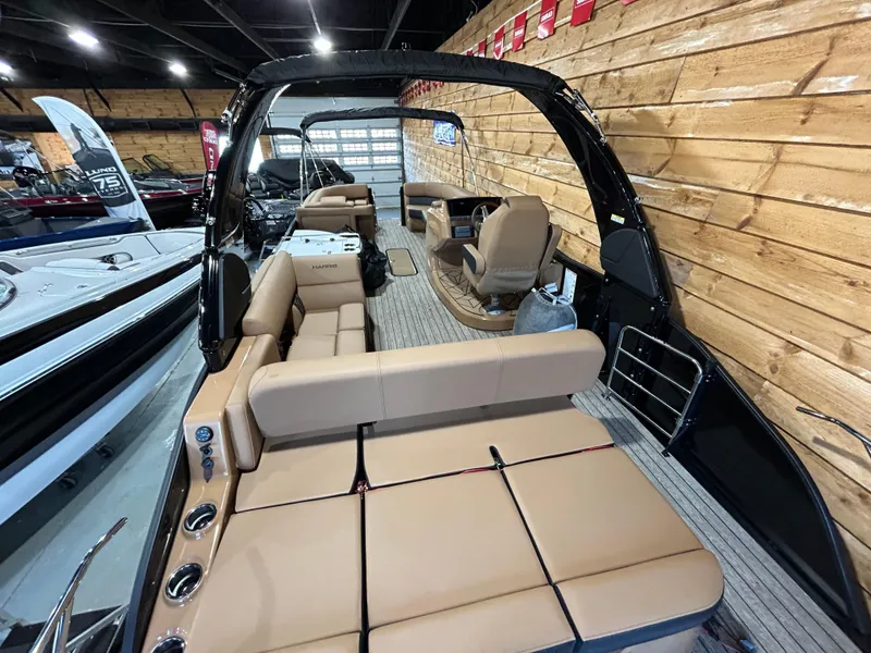 Slide: The Image of 2025 Harris Grand Mariner 250 SLEC luxury pontoon boat interior with tan seating. - 3