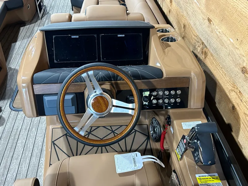 Slide: The Image of 2025 Harris Grand Mariner 250 SLEC dashboard with dual screens and modern controls. - 4
