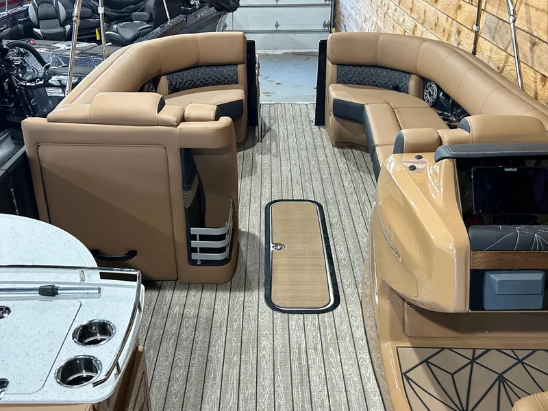 Slide: The Image of Luxurious 2025 Harris Grand Mariner 250 SLEC pontoon boat interior with plush seating and modern design. - 5