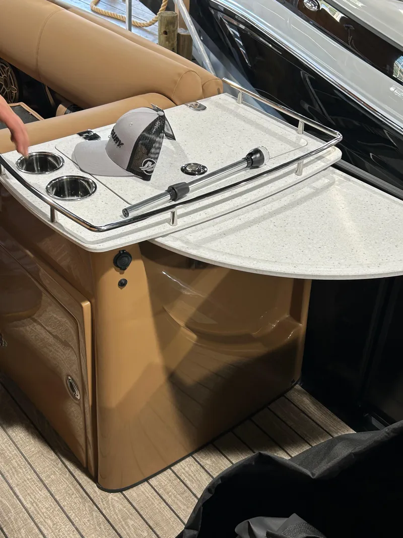 Slide: The Image of 2025 Harris Grand Mariner 250 SLEC boat interior with bar and cup holders. - 7