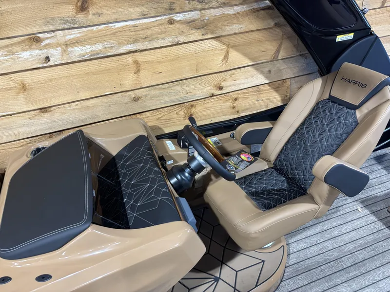 Slide: The Image of 2025 Harris Grand Mariner 250 SLEC interior with luxury seating and modern dashboard design. - 9