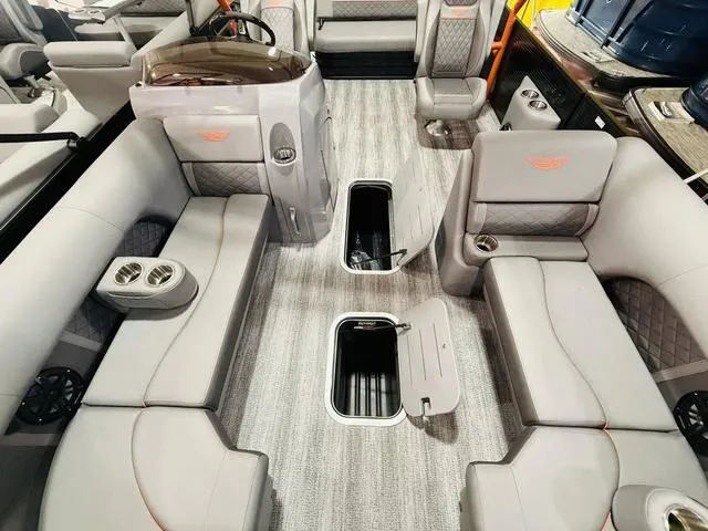Slide: The Image of Luxurious interior of 2025 Bennington L Swingback 23 LSBA pontoon boat with plush seating. - 15
