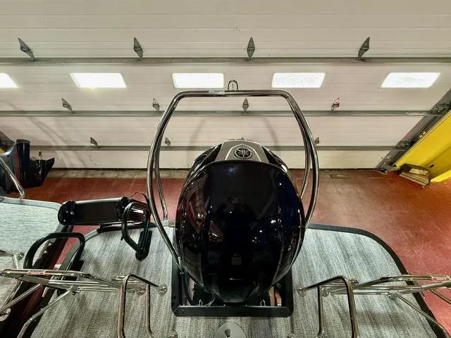 Slide: The Image of 2025 Bennington L Swingback 23 LSBA boat engine in a garage setting. - 18