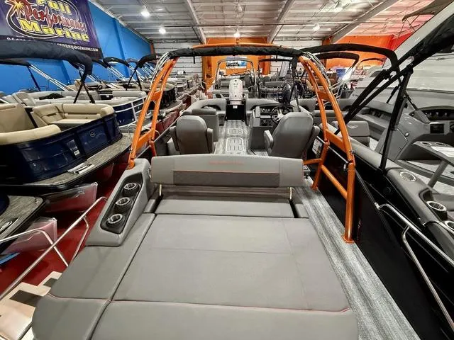 Slide: The Image of 2025 Bennington L Swingback 23 LSBA pontoon boat interior with seating and cup holders. - 19