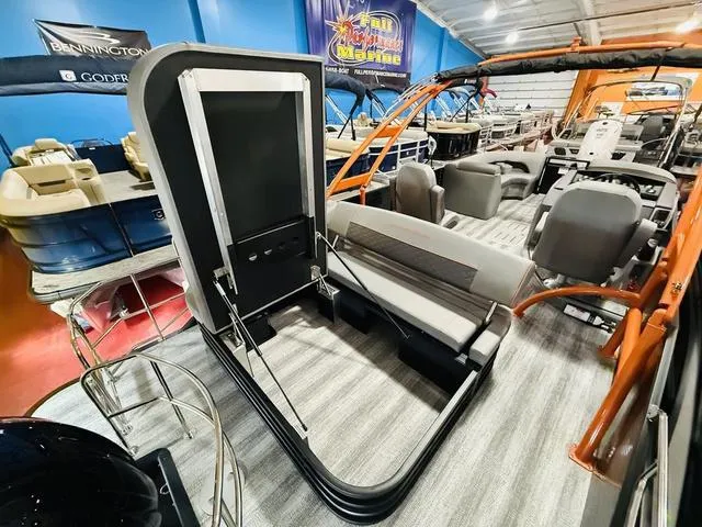 Slide: The Image of 2025 Bennington L Swingback 23 LSBA pontoon boat interior with seating and helm. - 20