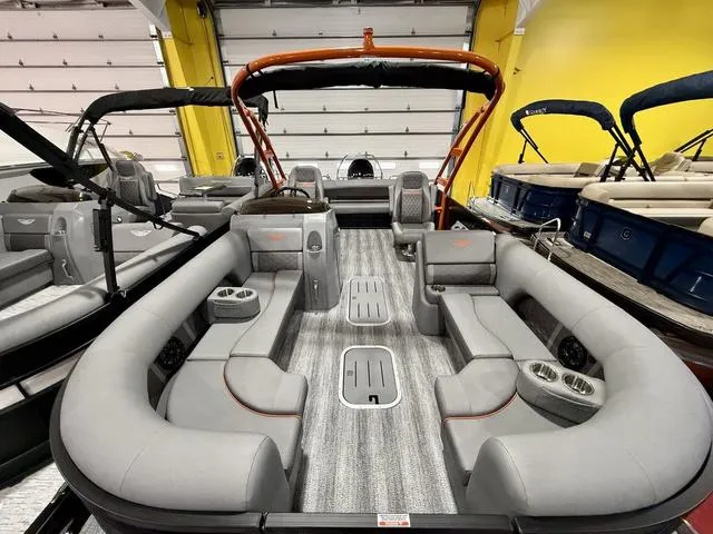 Slide: The Image of 2025 Bennington L Swingback 23 LSBA pontoon boat with luxurious seating and modern design. - 3