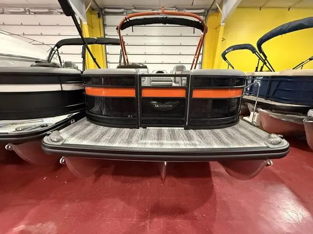 Slide: The Image of 2025 Bennington L Swingback 23 LSBA pontoon boat in showroom, front view. - 4