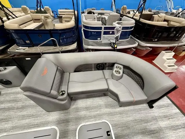 Slide: The Image of 2025 Bennington L Swingback 23 LSBA pontoon boat interior with gray seating and cup holders. - 8