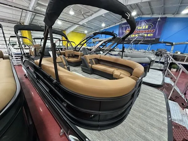 Slide: The Image of 2025 Bennington M Swingback 24 MSB boat interior with tan seating and modern design. - 13