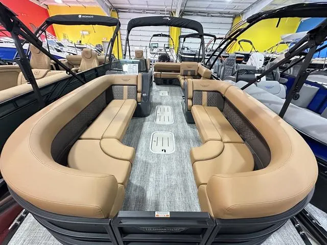 Slide: The Image of 2025 Bennington M Swingback 24 MSB boat interior with tan seating and modern design. - 14