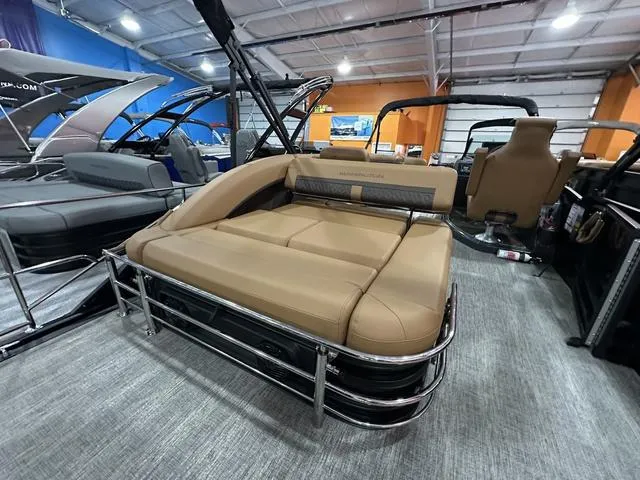 Slide: The Image of 2025 Bennington M Swingback 24 MSB pontoon boat with tan seating on display. - 16