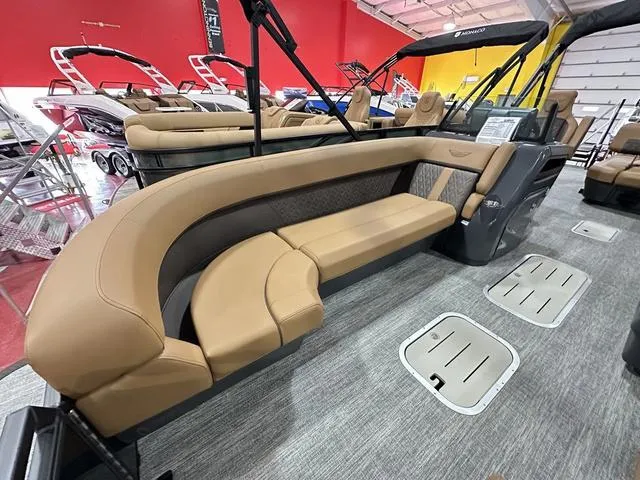 Slide: The Image of 2025 Bennington M Swingback 24 MSB pontoon boat interior with tan seating and modern design. - 28