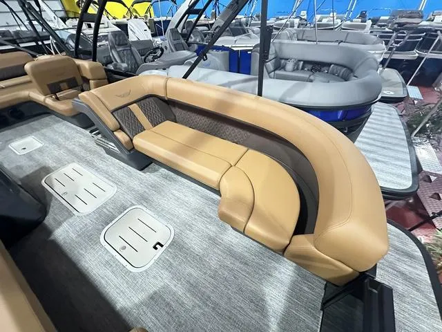Slide: The Image of 2025 Bennington M Swingback 24 MSB pontoon boat interior with luxurious seating. - 5