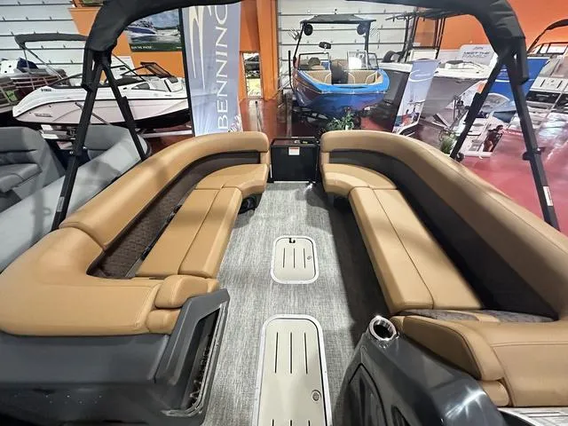 Slide: The Image of 2025 Bennington M Swingback 24 MSB boat interior with tan seating and modern design. - 6