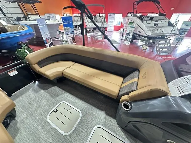 Slide: The Image of 2025 Bennington M Swingback 24 MSB pontoon boat interior with tan seating. - 7