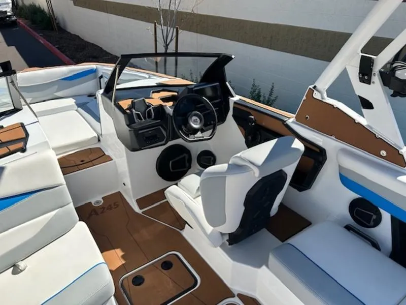 Slide: The Image of 2025 Axis A245 boat interior with white seating and modern dashboard. - 12
