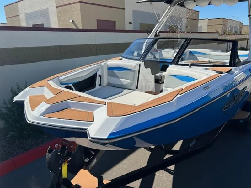 Slide: The Image of 2025 Axis A245 boat with sleek design and spacious seating on a trailer. - 9