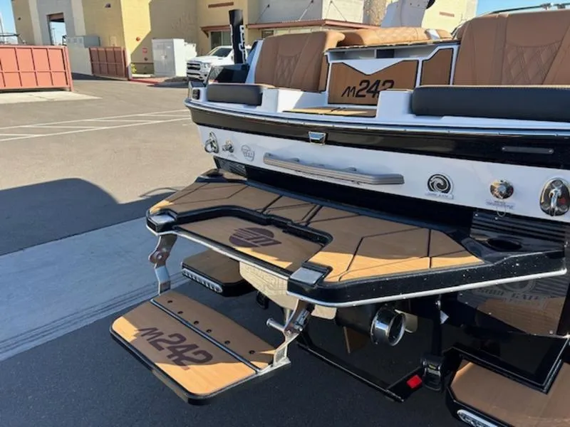 Slide: The Image of 2025 Malibu M242 boat with sleek design and modern features. - 10