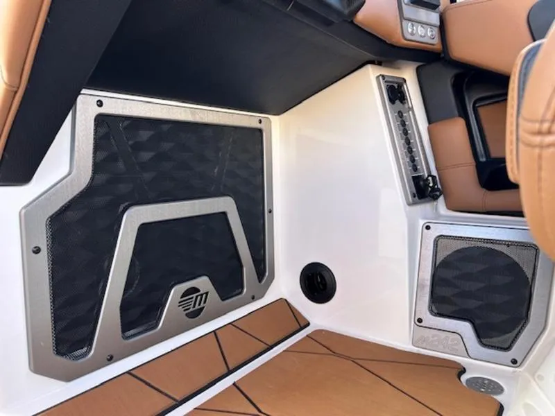 Slide: The Image of 2025 Malibu M242 interior with premium audio system and luxurious seating. - 15