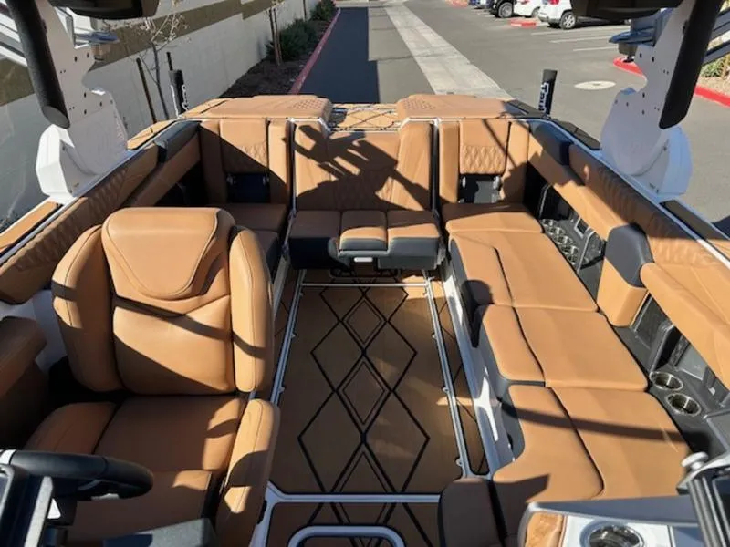 Slide: The Image of Luxurious interior of 2025 Malibu M242 boat with tan leather seating. - 20