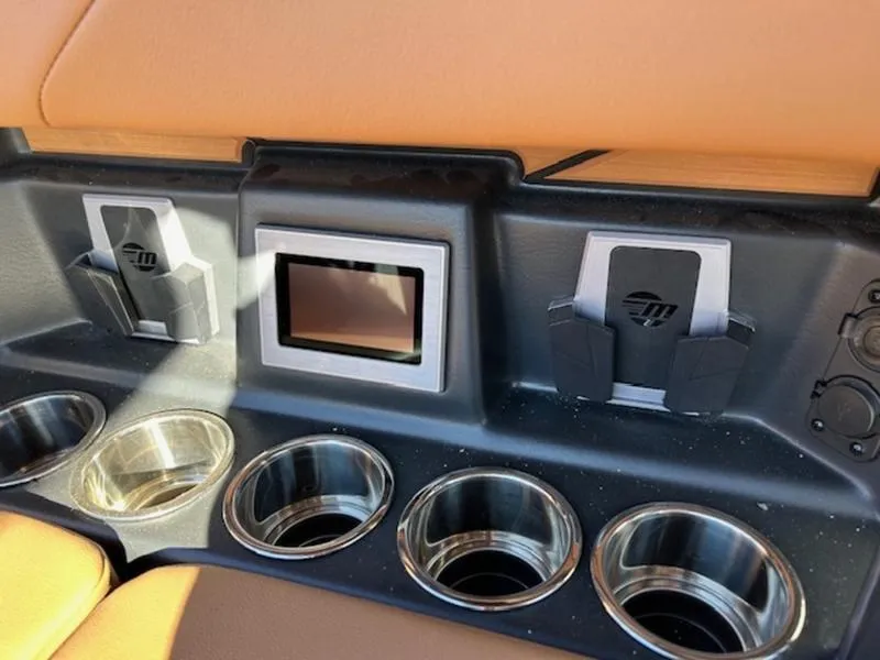 Slide: The Image of 2025 Malibu M242 interior with cup holders and device slots. - 30