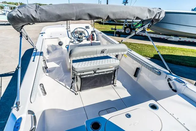 Slide: The Image of 2025 Carolina Skiff 21LS boat interior with seating and steering console. - 12