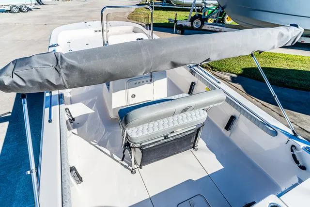 Slide: The Image of 2025 Carolina Skiff 21LS boat interior with seating and covered console. - 13