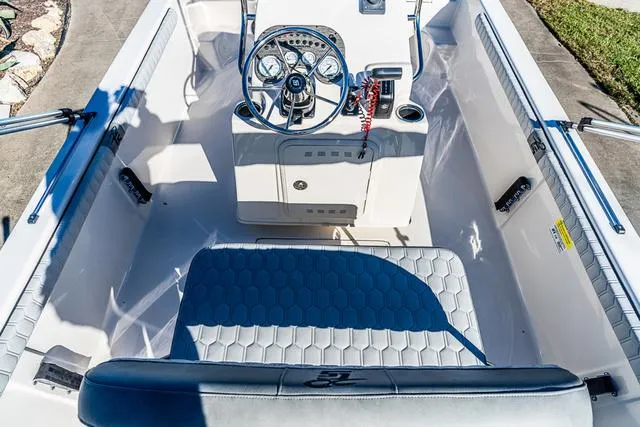 Slide: The Image of 2025 Carolina Skiff 21LS boat interior with steering console and seating. - 15