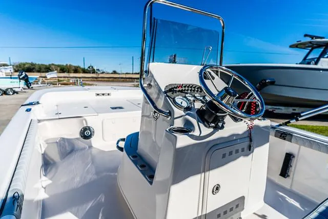 Slide: The Image of 2025 Carolina Skiff 21LS boat interior with steering console and gauges. - 5