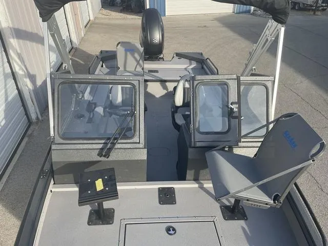 Slide: The Image of 2025 SeaArk Pro Cat 200 boat interior with seating and windshield. - 14