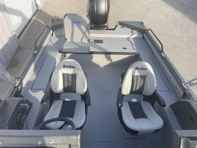 Slide: The Image of 2025 SeaArk Pro Cat 200 boat interior with dual seats and steering wheel. - 15