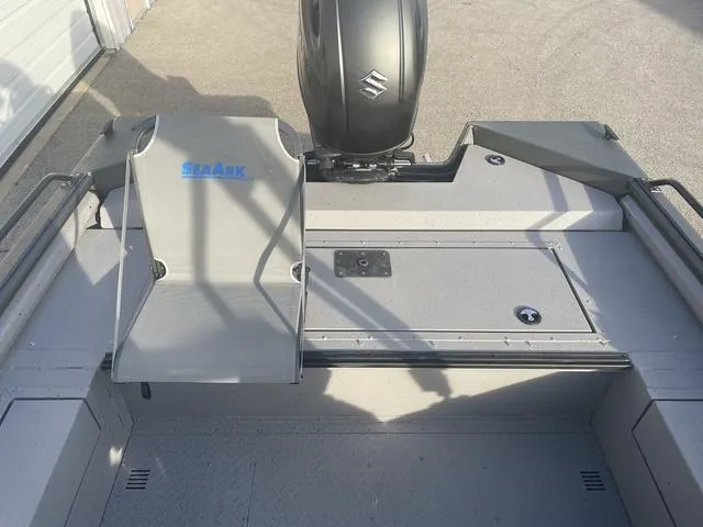 Slide: The Image of 2025 SeaArk Pro Cat 200 boat interior with Suzuki engine, gray deck, and storage compartments. - 18