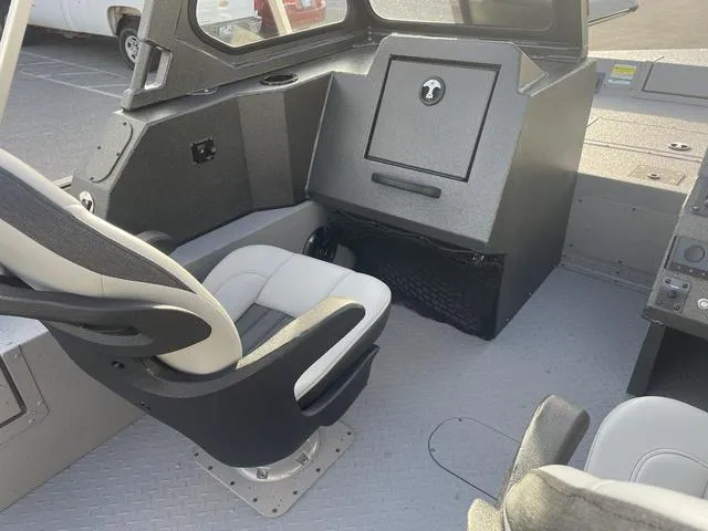 Slide: The Image of 2025 SeaArk Pro Cat 200 boat interior with seating and console. - 20