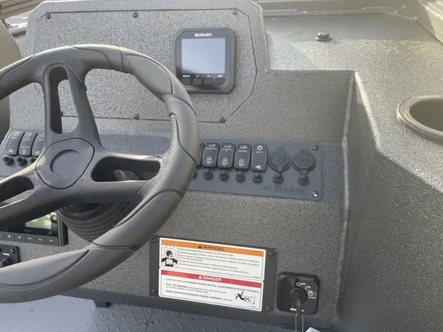 Slide: The Image of 2025 SeaArk Pro Cat 200 dashboard with steering wheel and control panel. - 23
