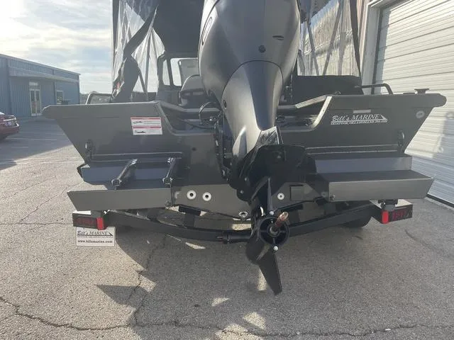 Slide: The Image of 2025 SeaArk Pro Cat 200 boat rear view with outboard motor in sunlight. - 8