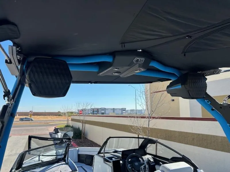 Slide: The Image of 2025 Malibu 25 LSV boat interior with speakers and steering wheel. - 12