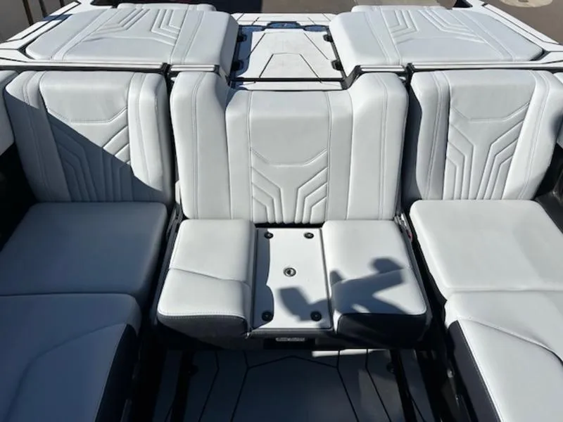 Slide: The Image of 2025 Malibu 25 LSV boat interior with sleek, modern seating design. - 18