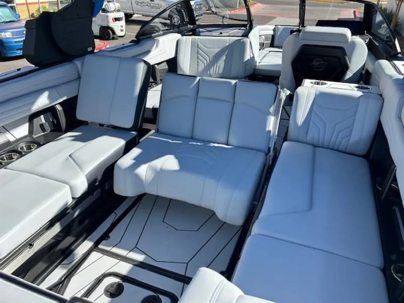 Slide: The Image of Luxurious interior of 2025 Malibu 25 LSV boat with white seating. - 19