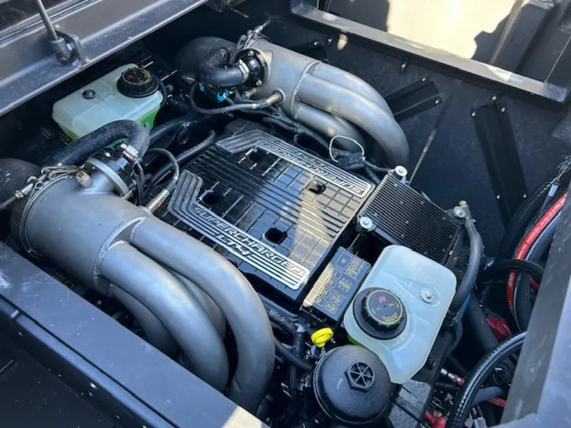 Slide: The Image of 2025 Malibu 25 LSV engine compartment with detailed components and wiring. - 2