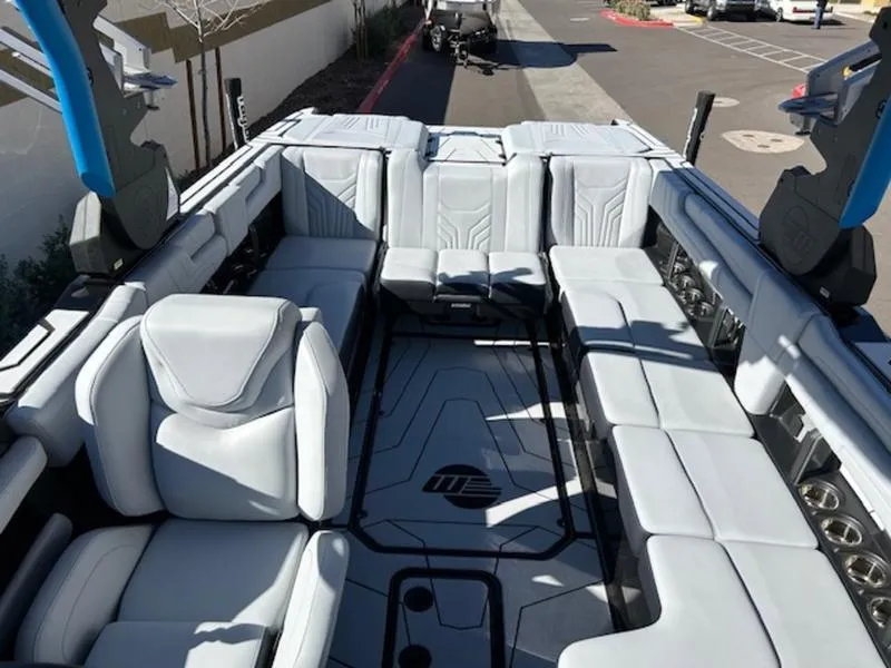 Slide: The Image of 2025 Malibu 25 LSV boat interior with spacious seating and modern design. - 22