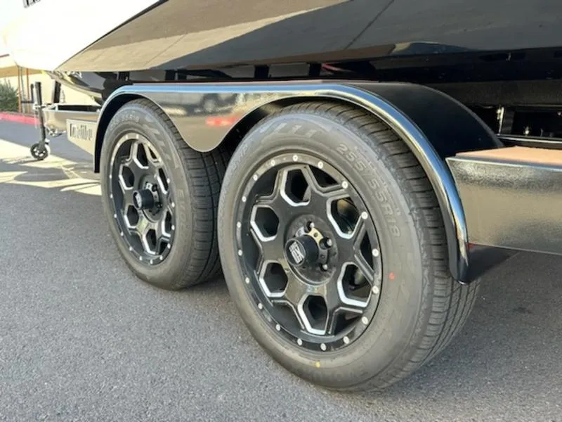 Slide: The Image of 2025 Malibu 22 LSV trailer with stylish black wheels and tires. - 11